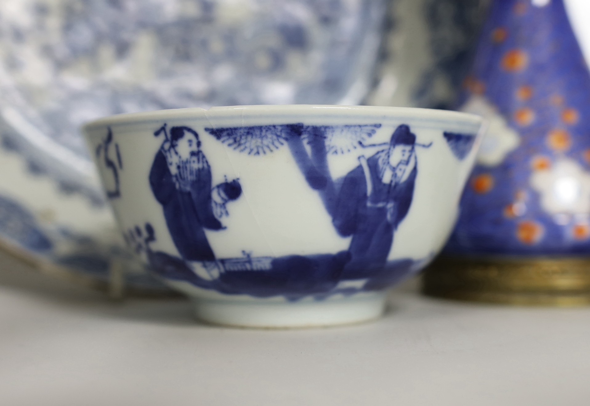 Three Chinese blue and white dishes and a bowl, together with an Imari vase. Largest 23cm diameter